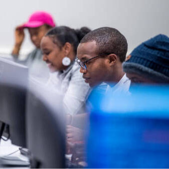 Graduate students using computer